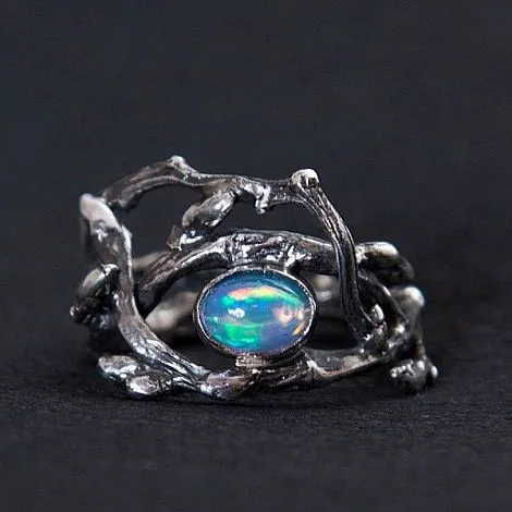Серебряное кольцо "Блуждающий огонек" с опалом
